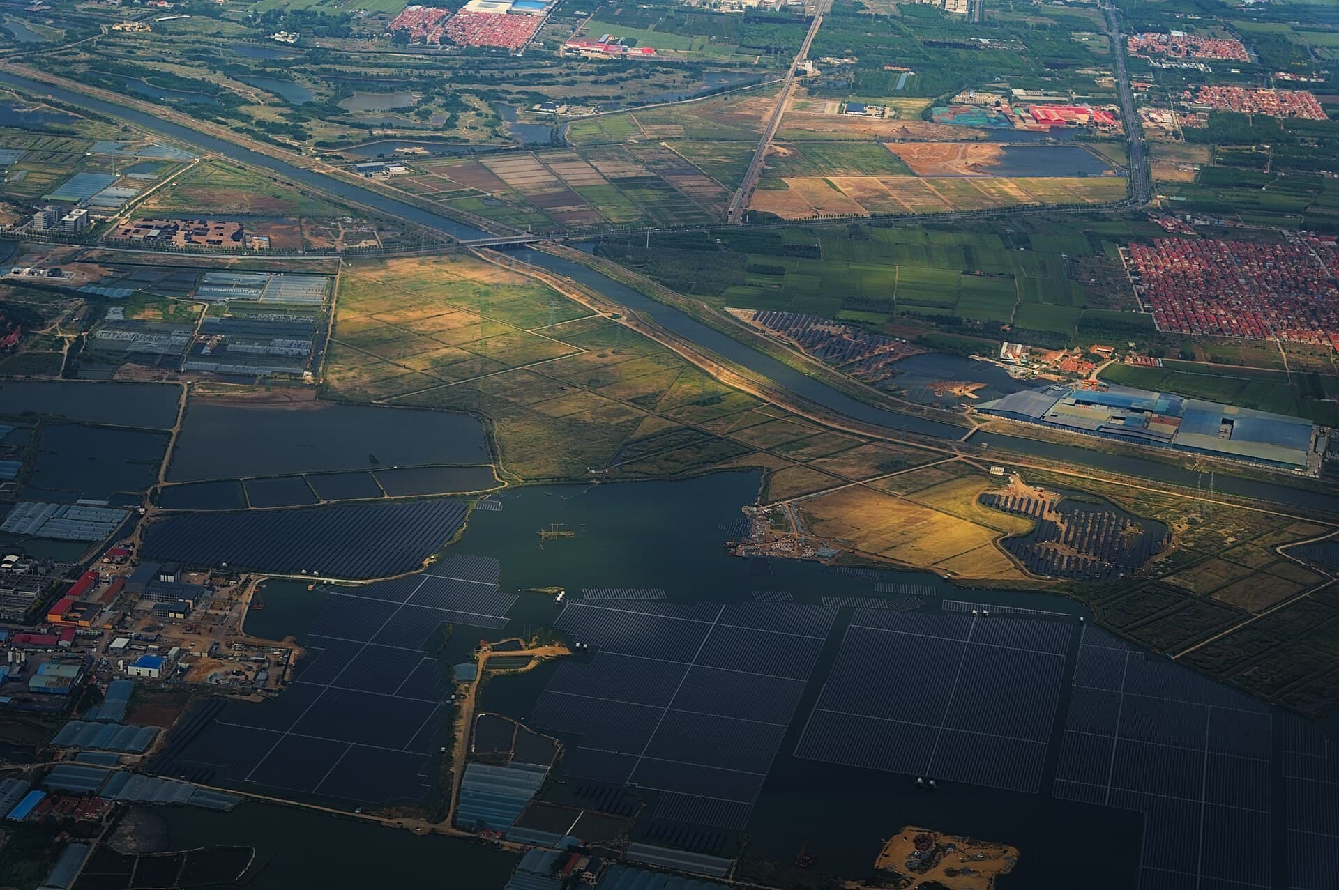 Rows of solar panels stretching across a utility-scale solar farm.